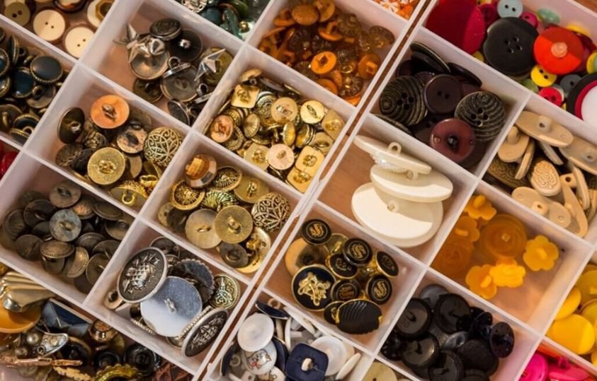 Assorted garment buttons and clothing accessories used in apparel production by custom apparel manufacturers