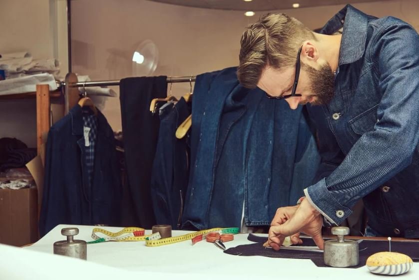 Designer creating garment pattern during apparel product development at a Custom Apparel Manufacturer in China